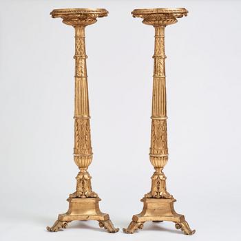 A pair of Swedish Empire giltwood gueridons, Stockholm, first part of the 19th century.