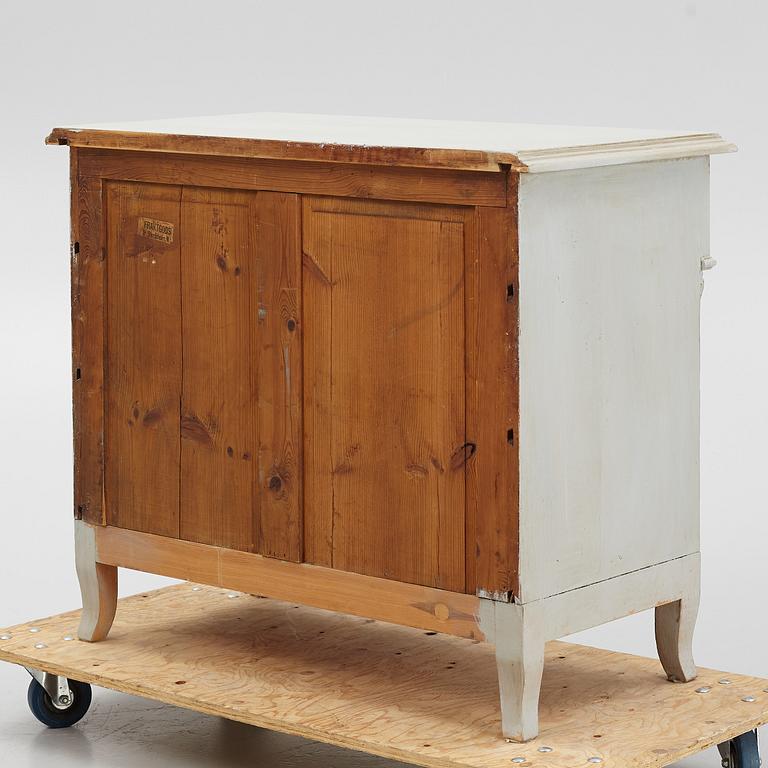 A chest of drawers, circa 1900.