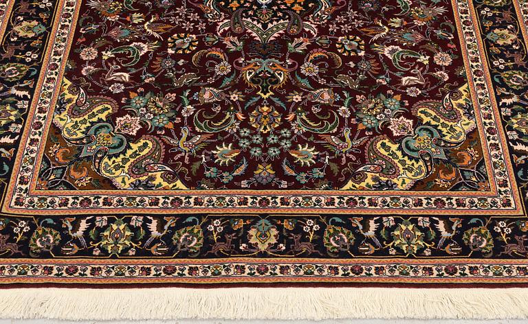 A part silk Tabriz rug, so-called 50 Radj, approx. 200 x 148 cm.