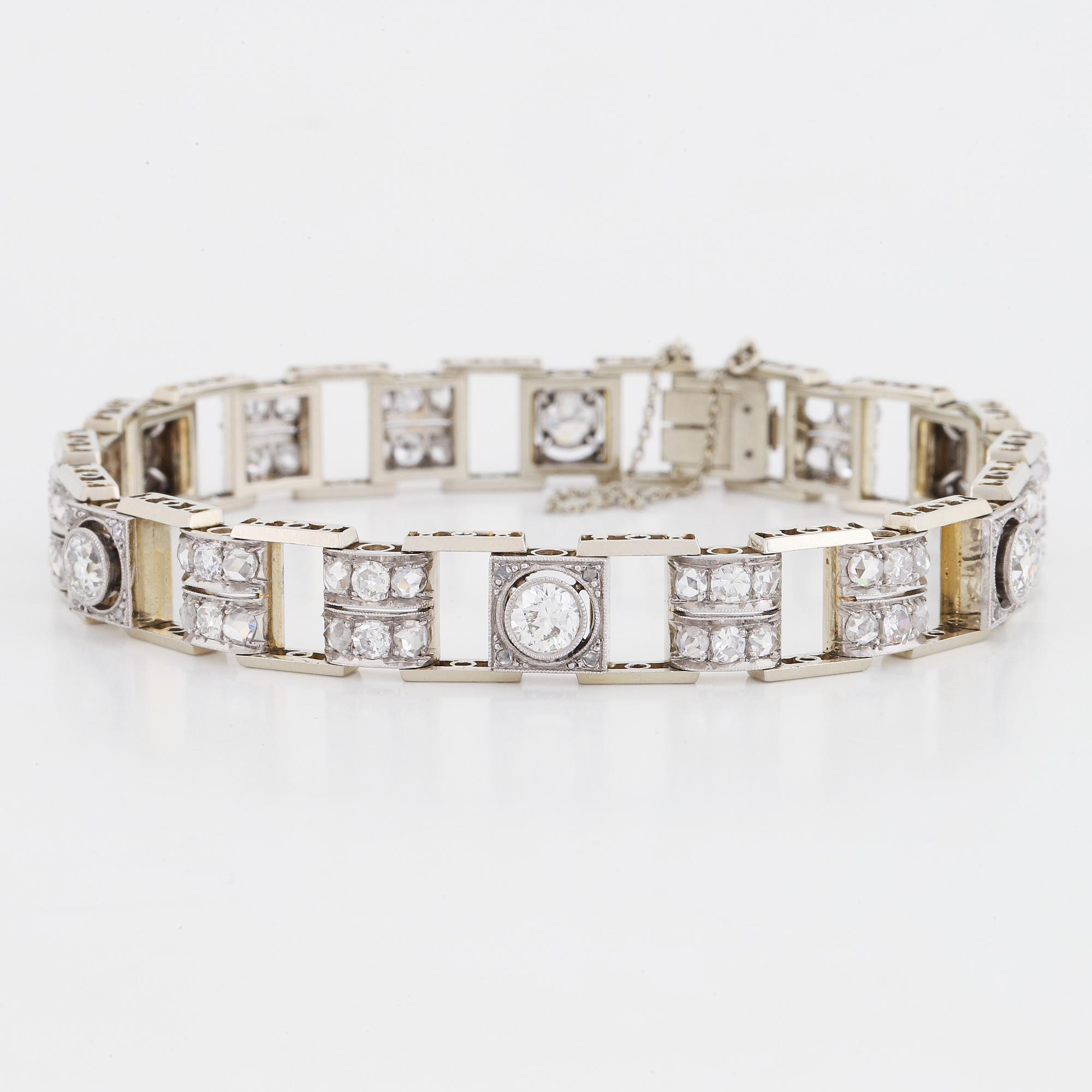 An 18K white gold bracelet set with old- and rose-cut diamonds.