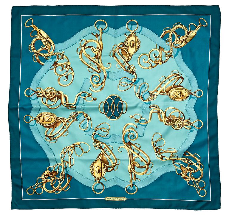 A silk scarf by Hermès.