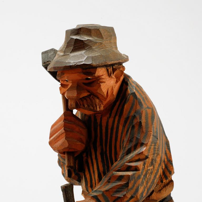 A signed wooden sculpture by CARL OLOF TRYGG.