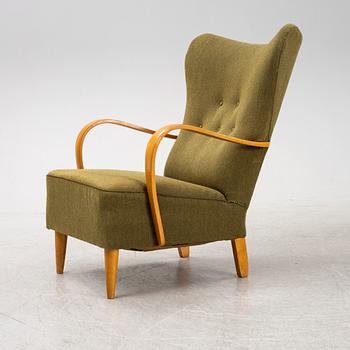 A 1940's wingback armchair.