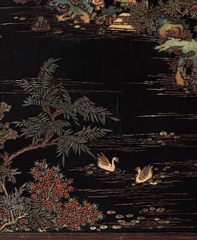 A set of four Chinese lacquer panels with wooden frames, early 20th century.