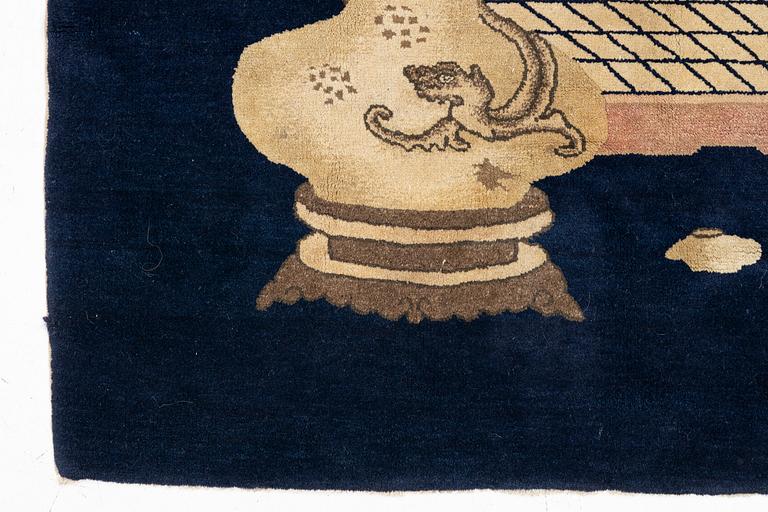 A semi-antique Baotou rug, approx. 185 x 122 cm.