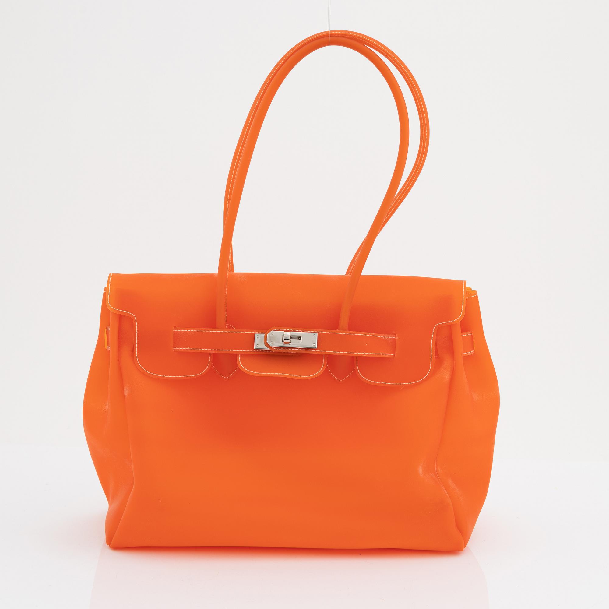 I santi an orange rubber bag.