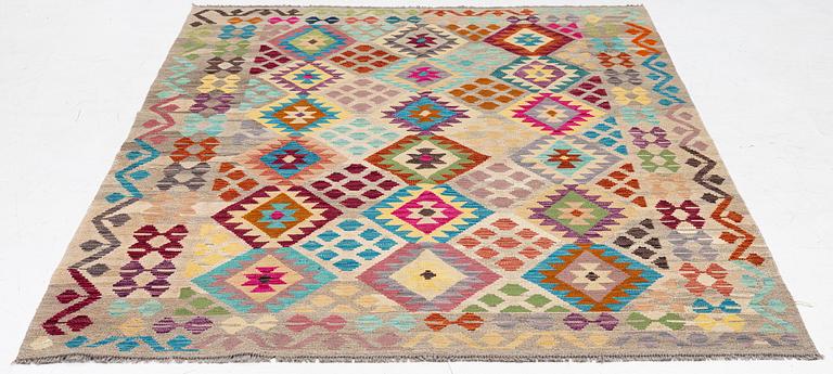 A Kelim rug, c. 252 x 180 cm.