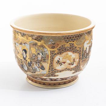A Japanese satsuma figural flower pot, early 20th century.