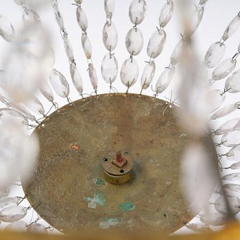 An French Empire eight-light gilt-brass and cut-glass chandelier.