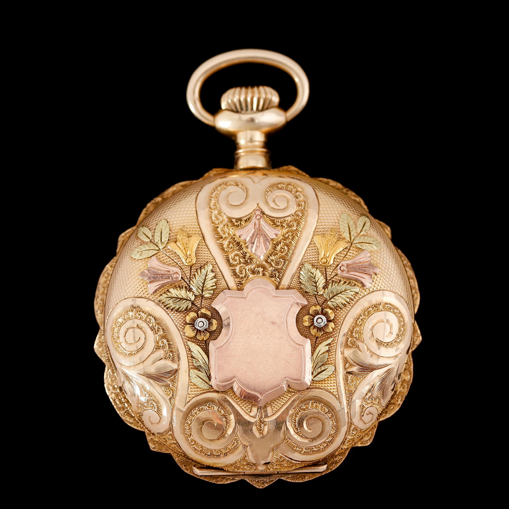 FICKUR, 14 k, flerfärgat guld, Elgin, sekelskiftet 1900. Total vikt ca 52 g.