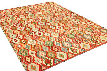A Kilim carpet, c. 396 x 307 cm.