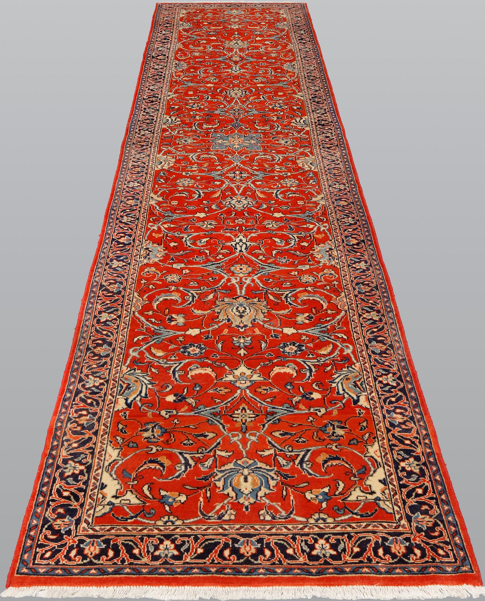 A Sarouk runner, 410 x 80 cm.