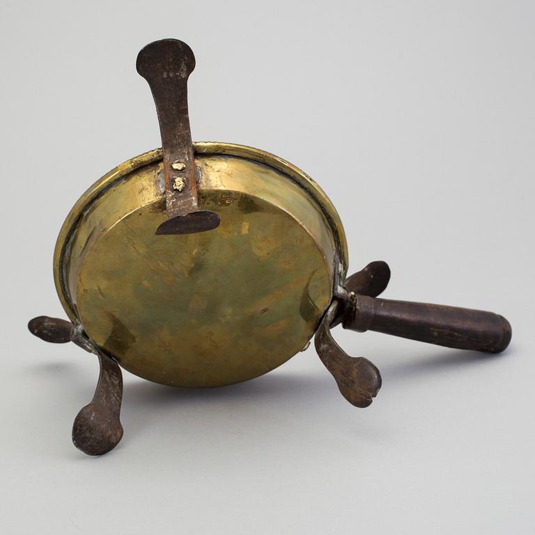 An 18th century brass brazier.