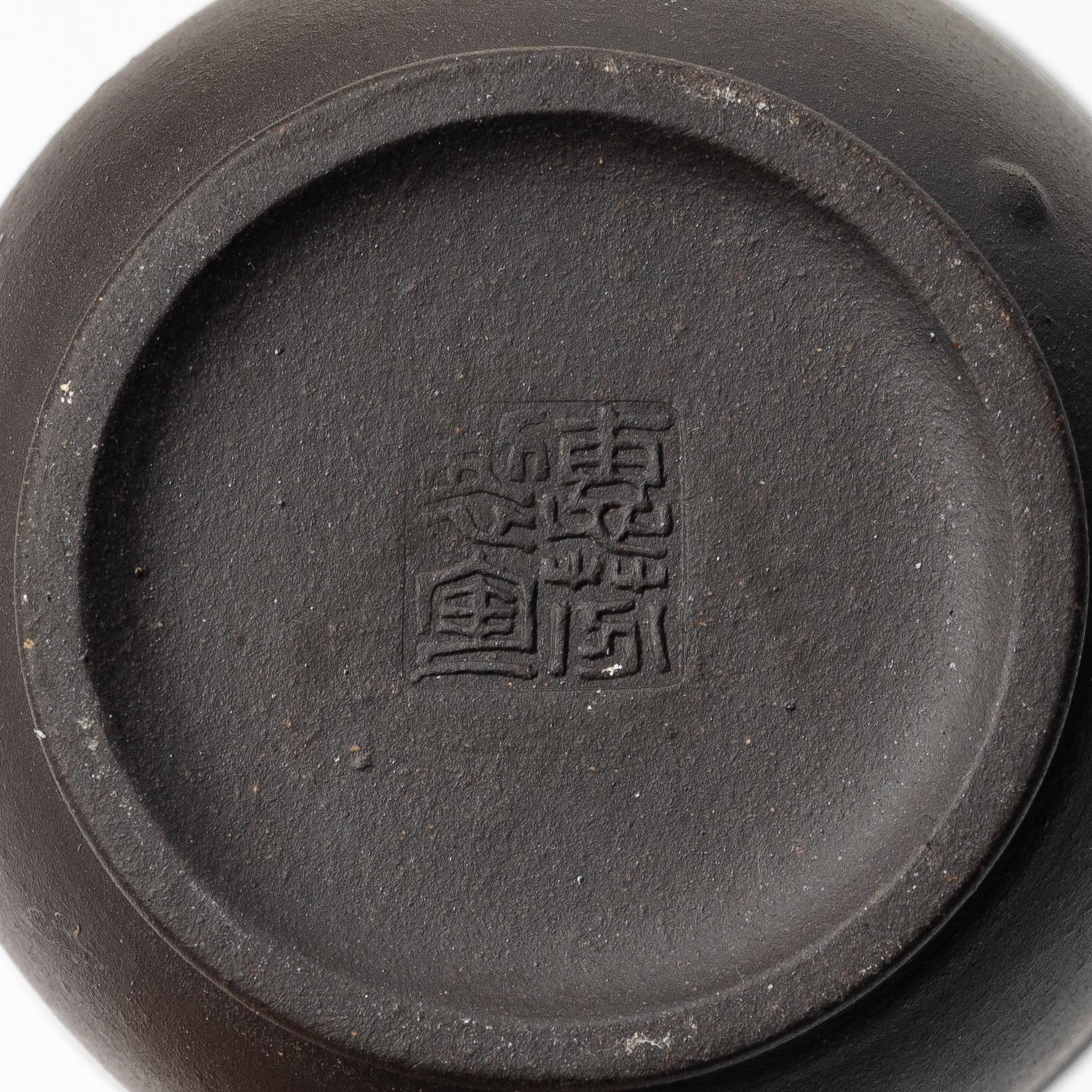 A group of three yixing teapots and a box with cover, China, 1970/80s.