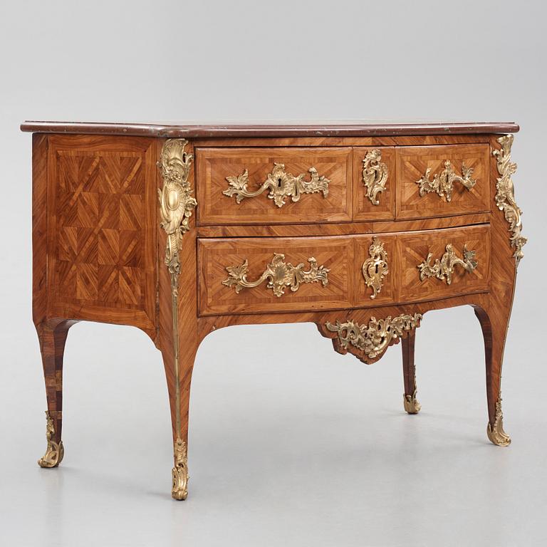 A Louis XV kingwood parquetry and ormolu-mounted commode in the manner of Jacques-Philippe Carel (Paris, 1723-1760).