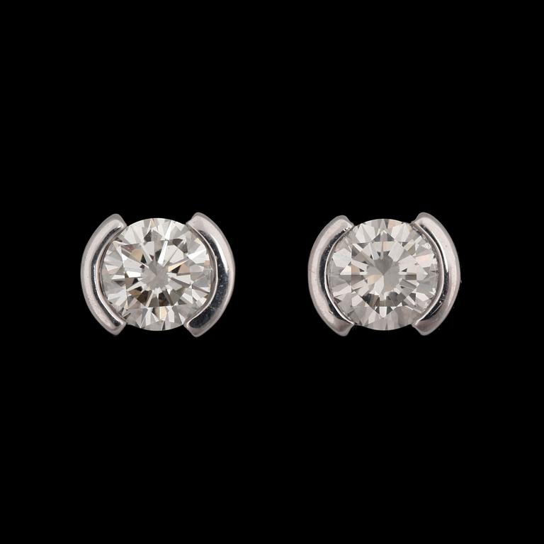 A pair of brilliant cut diamond earrings, tot. app. 1.60 cts.
