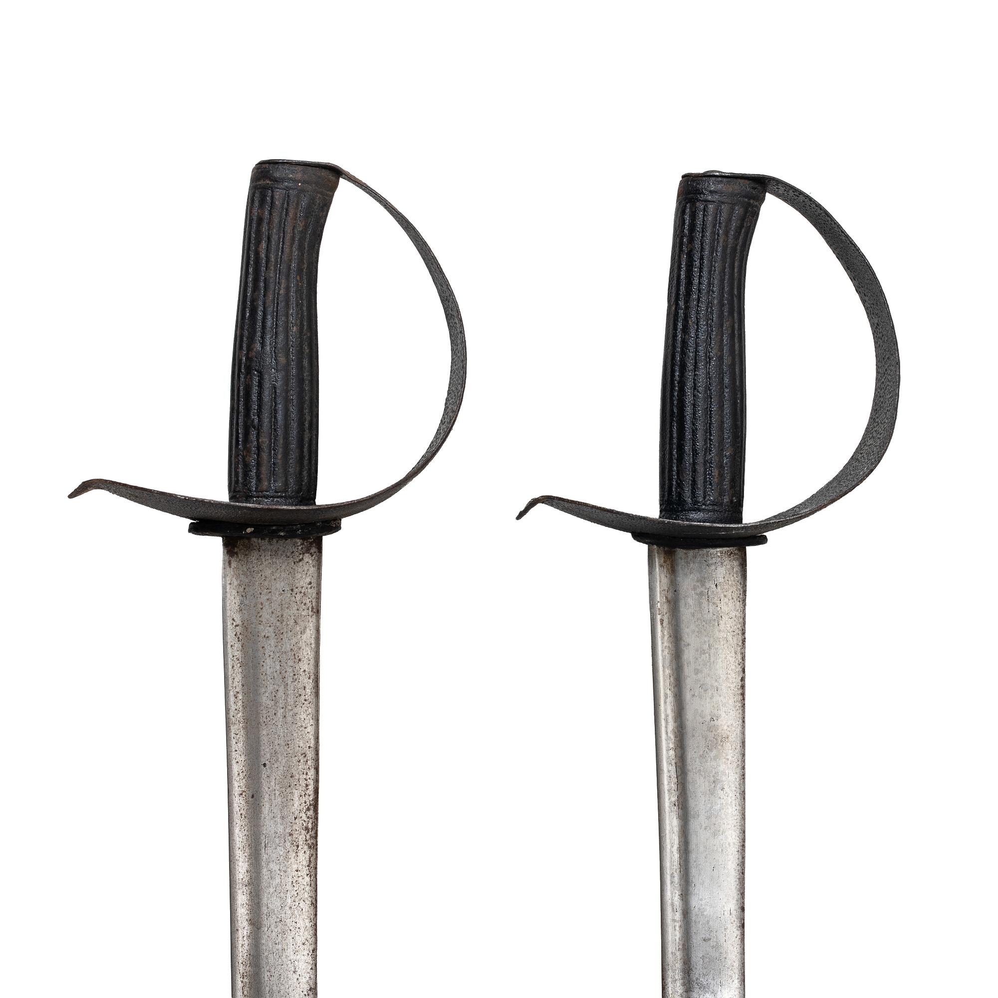 Two 19th century naval cutlasses.