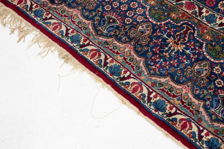 A Kerman carpet, c. 365 x 265 cm.