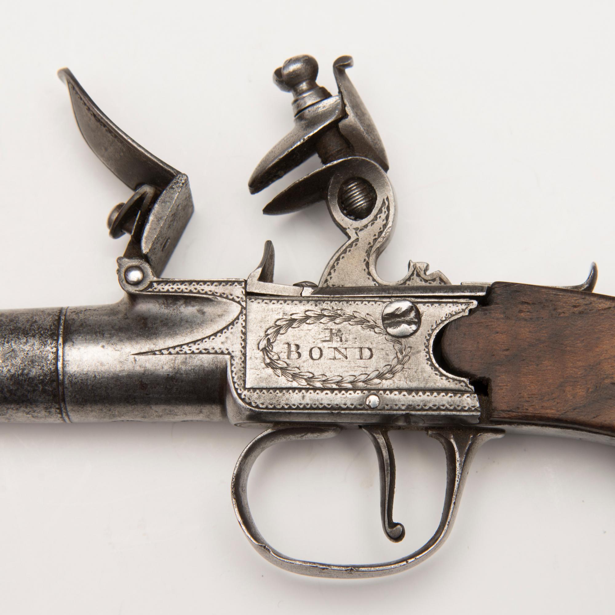 A pair of english boxlock flintock pistols marked E. Bond London, circa 1800.