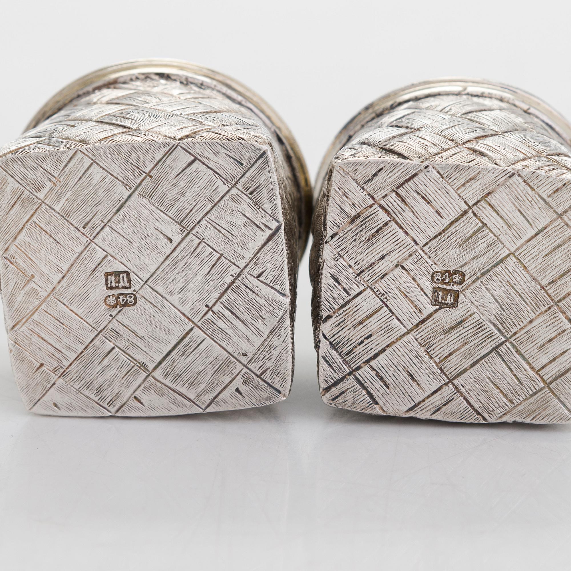 A silver and glass bottle with eight silver charka, maker marks of Pyotr Yermolajevich Davidov, Saint Petersburg, 1884.