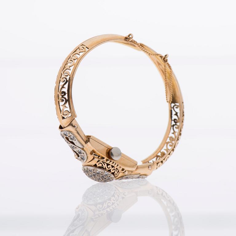 ARMBAND / ARMBANDSUR, 18K guld, åttkantslipade diamanter.