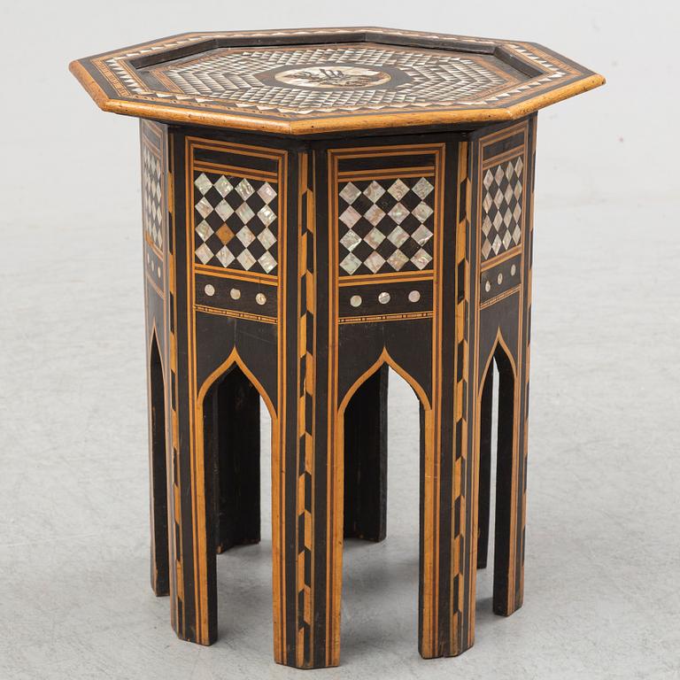 A mother of pearl and wood small table, 20th century.