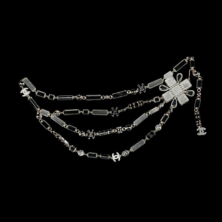 A plexiglass necklace/belt by Chanel, fall 2004.