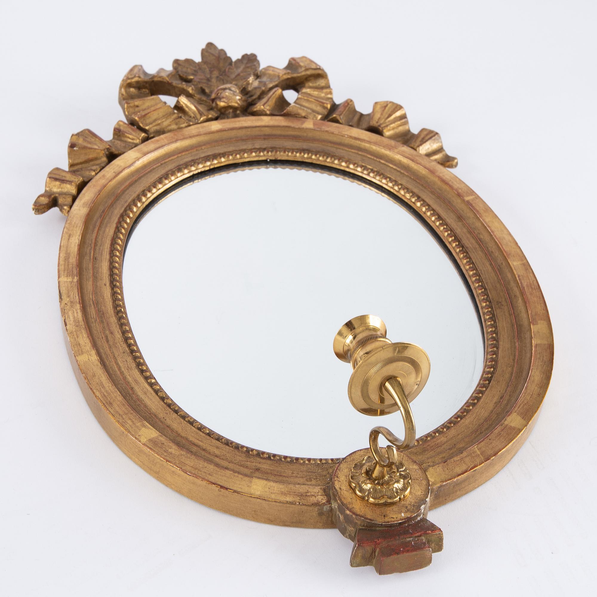 A pair of gilt Gustavian style mirror wall sconces, Stockholm, mid 20th Century.
