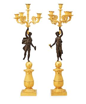 502. A pair of French Empire early 19th century five-light candelabra.