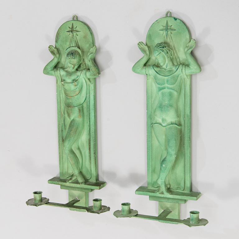 A pair of Art Deco wall sconces, patinated plaster and metal, A. E. Lindskog fecit MCMXXXX.