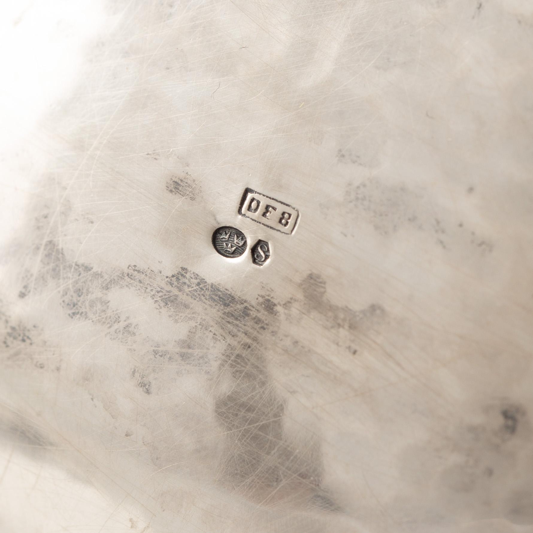 A Rococo-style silver coffee pot, creamer and sugar bowl, 20th Century.