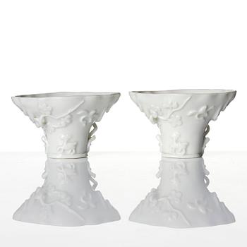 Two blanc de chine rhinoceros libation cups, Qing dynasty, Kangxi (1662-1722).