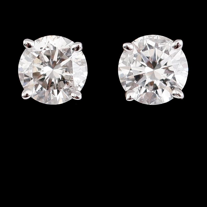 ÖRHÄNGEN, 1 par, 14 k vitguld, solitära briljantslipade diamanter tot ca 0.63 ct.