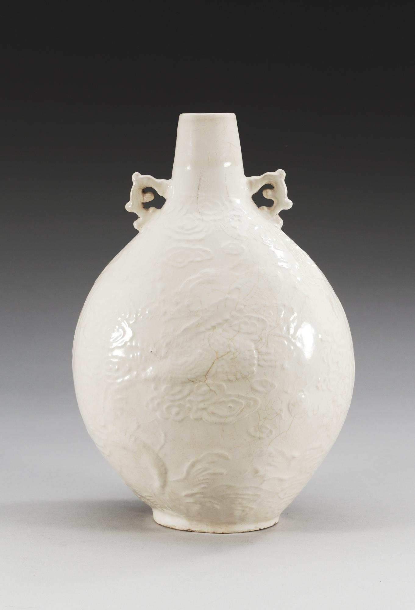 A Ding type soft paste pilgrim bottle vase, Ming dynasty (1368-1644).