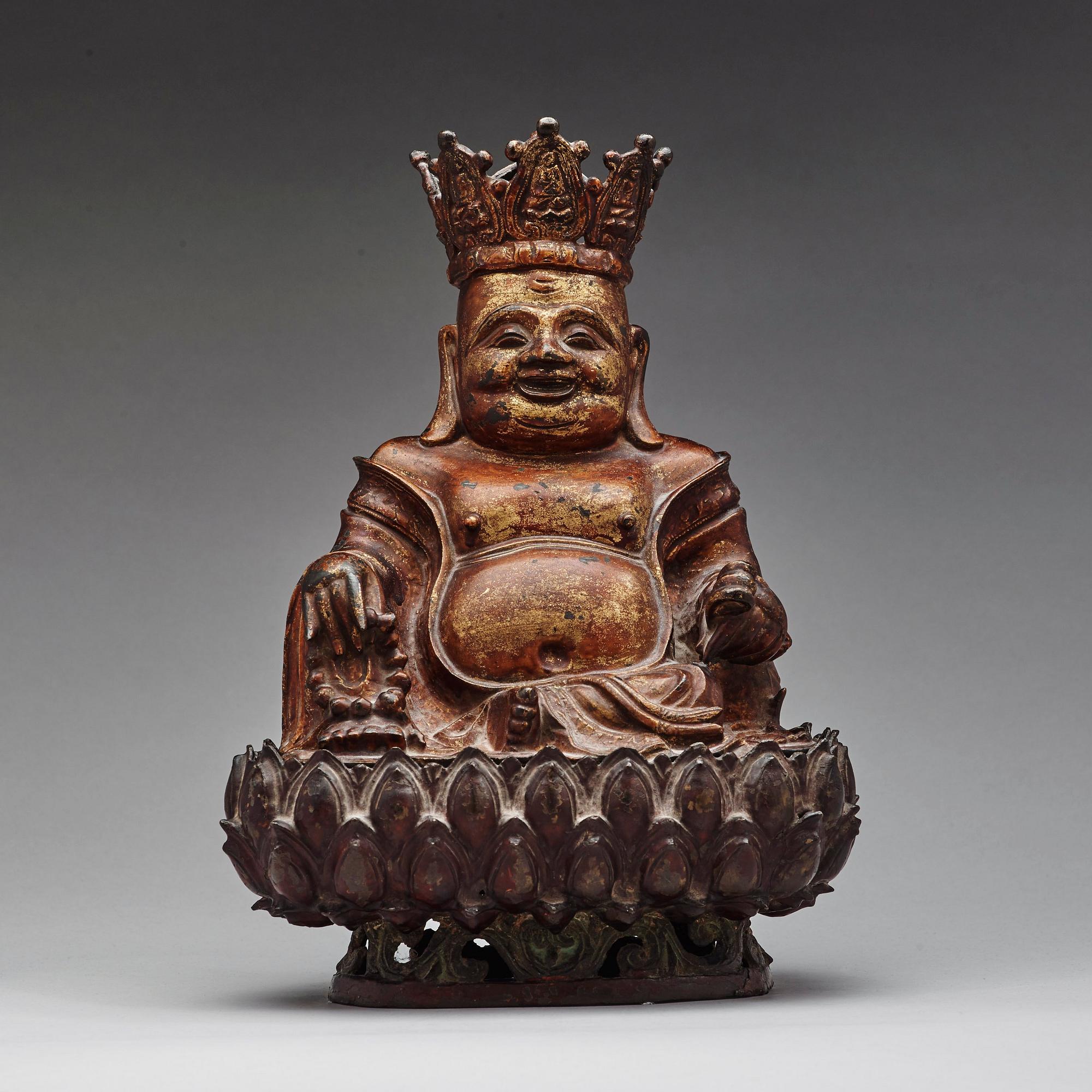 A large seated bronze figure of budhai, Ming dynasty (1368-1644).