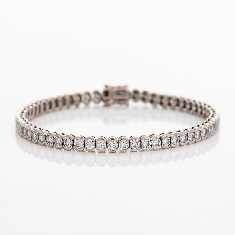 Tennisrannekoru, 18K valkokultaa, briljanttihiottuja timantteja.