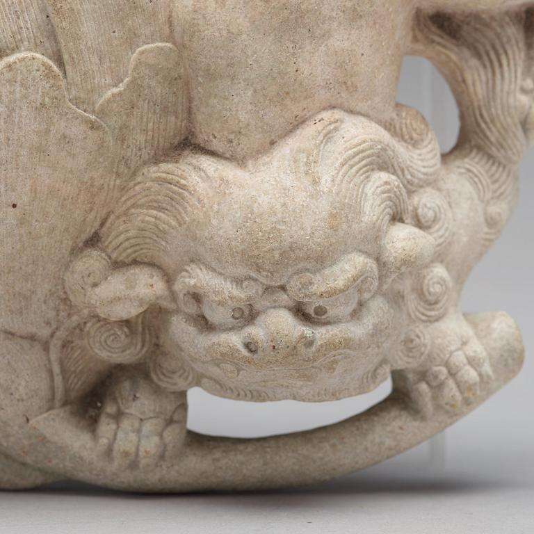 A wall vase in the shape of a mythical creature with a lotus bud, presumably 18th Century.