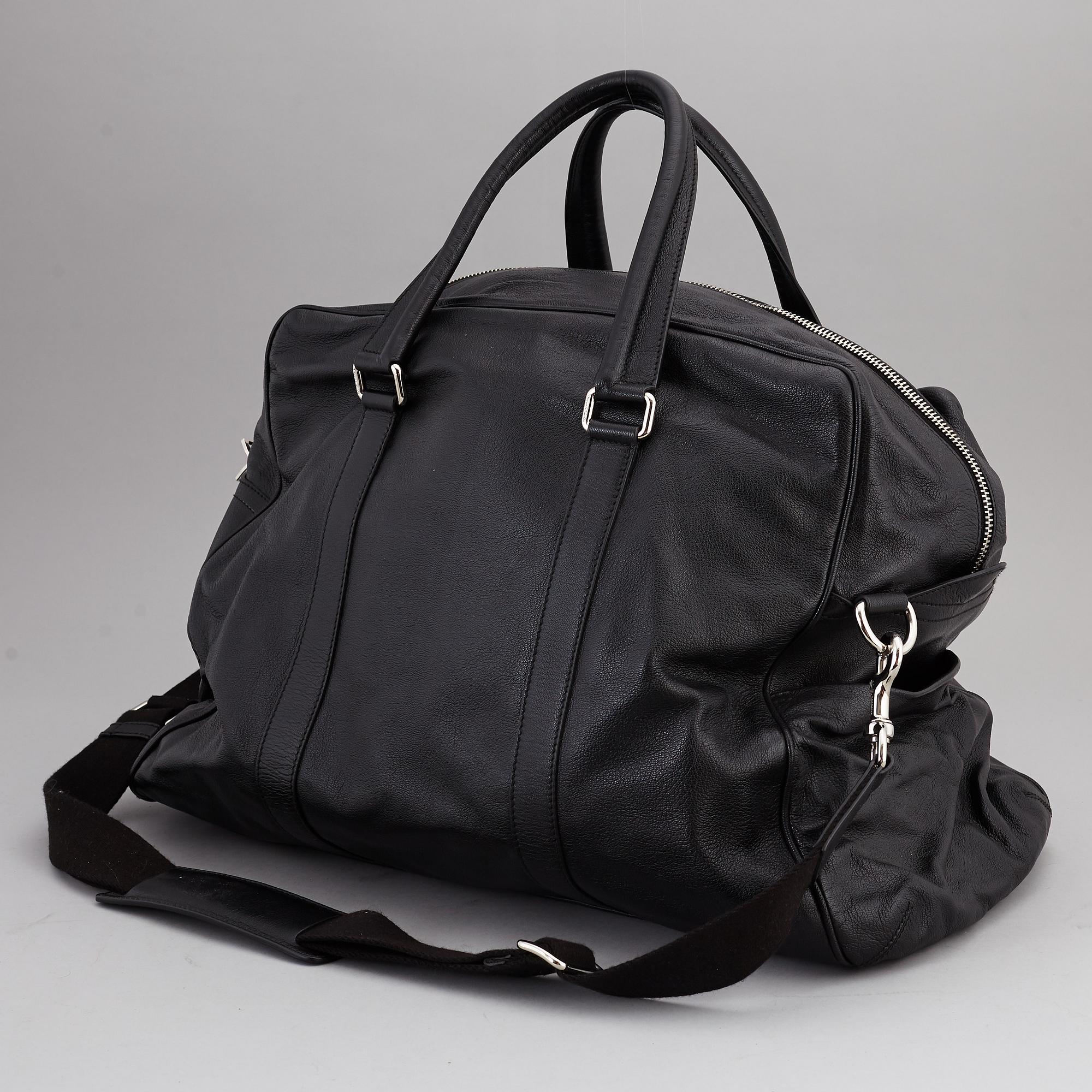 DOLCE & GABBANA, a black leather weekend bag, 2009.
