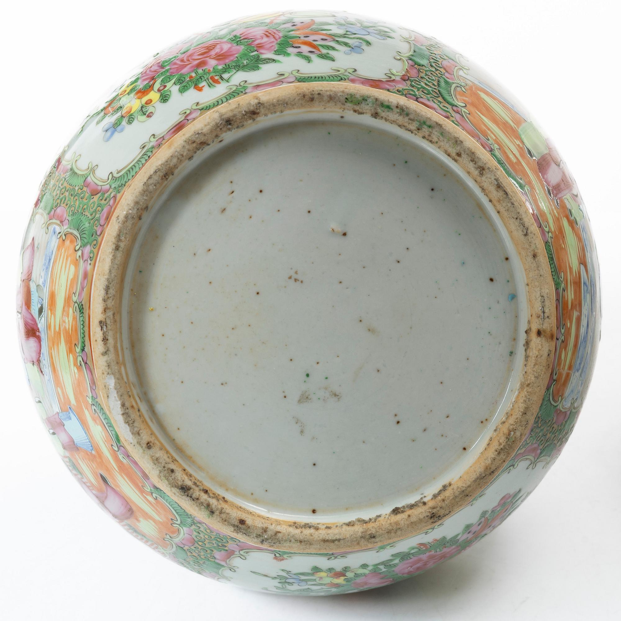 Two famille rose 'Canton' vases with covers, Qing dynasty, 19th century.