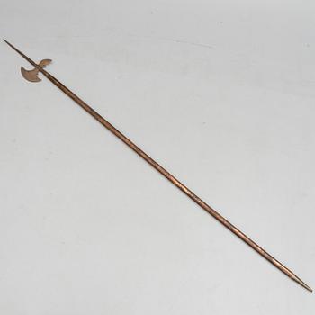 An 20th Century wood and iron halberd.