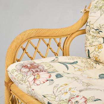 A rattan sofa and two armchairs, later part of the 20th century.