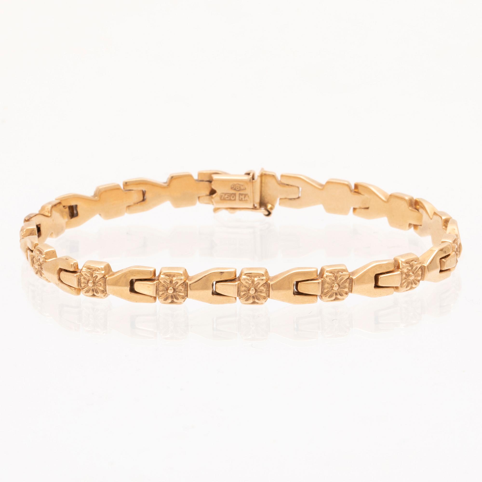 An 18K gold bracelet.