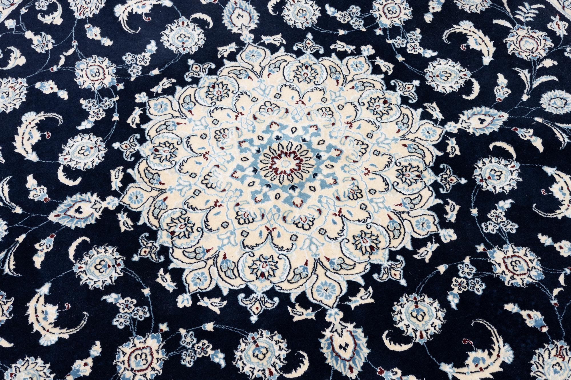 A Nain rug, diameter 243 cm.