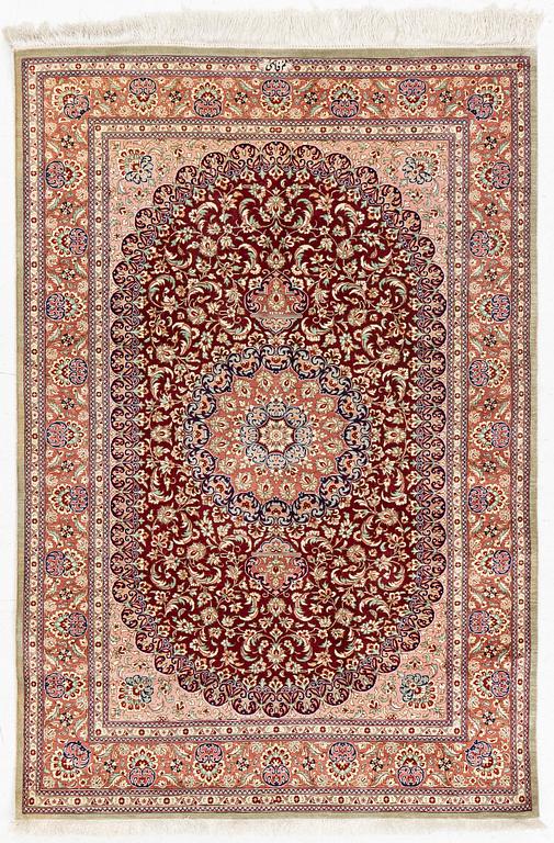 A oriental silk rug, c. 148 x 100 cm.