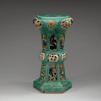 A green glazed Shiwan-ware stool, Qing dynasty, 19th Century.