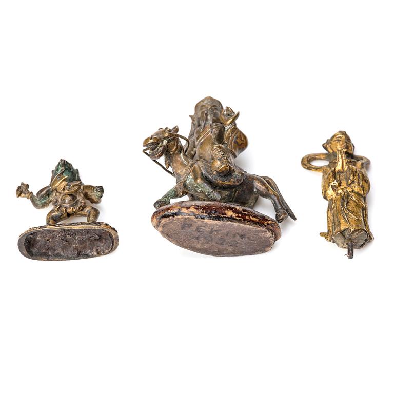 A group of three bronze miniatures sculptures of deities, China and Tibet, 18th Century.