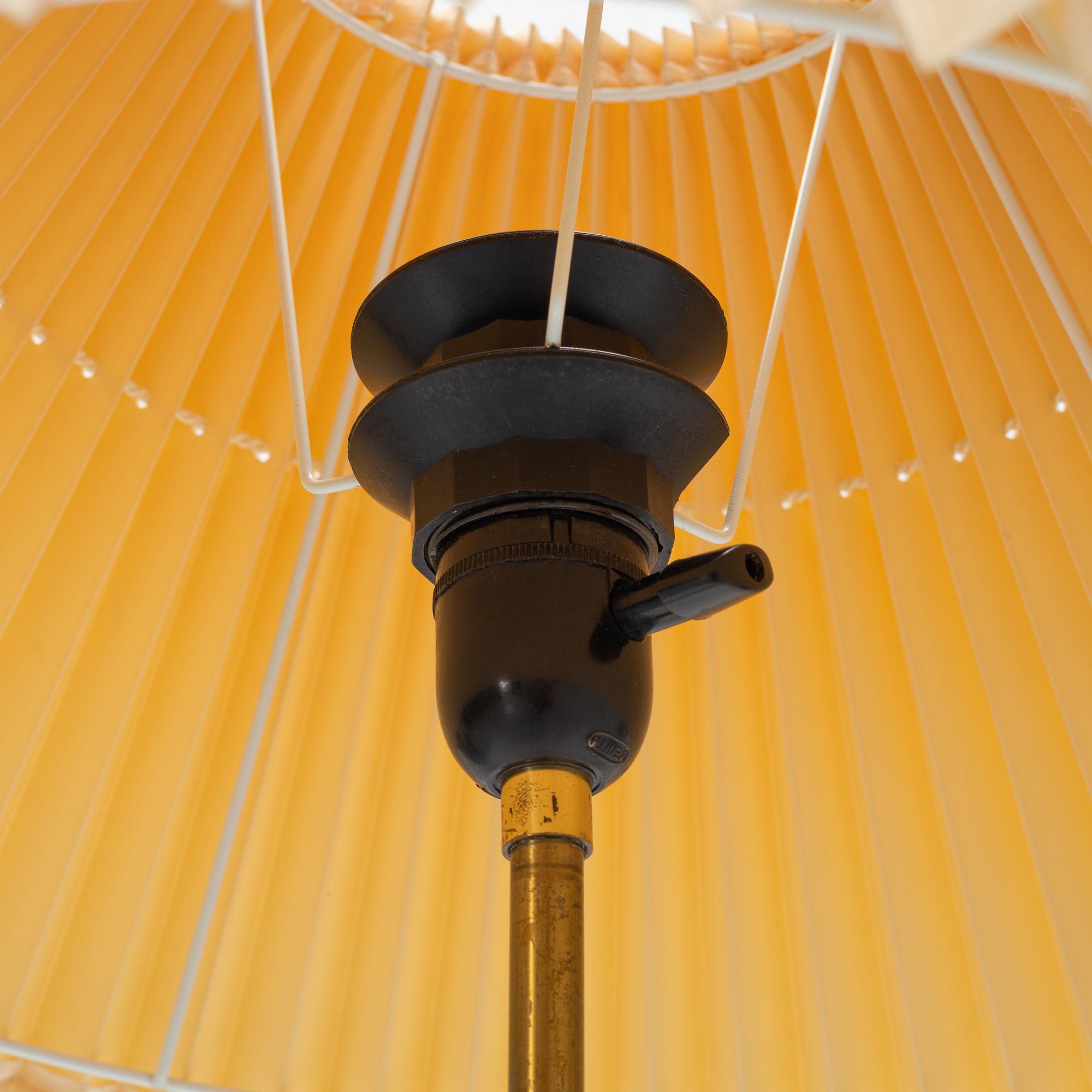 A brass floor light, seond part of the 20th Century.