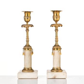 A pair of late Gustavian marble and bronze candlesticks.