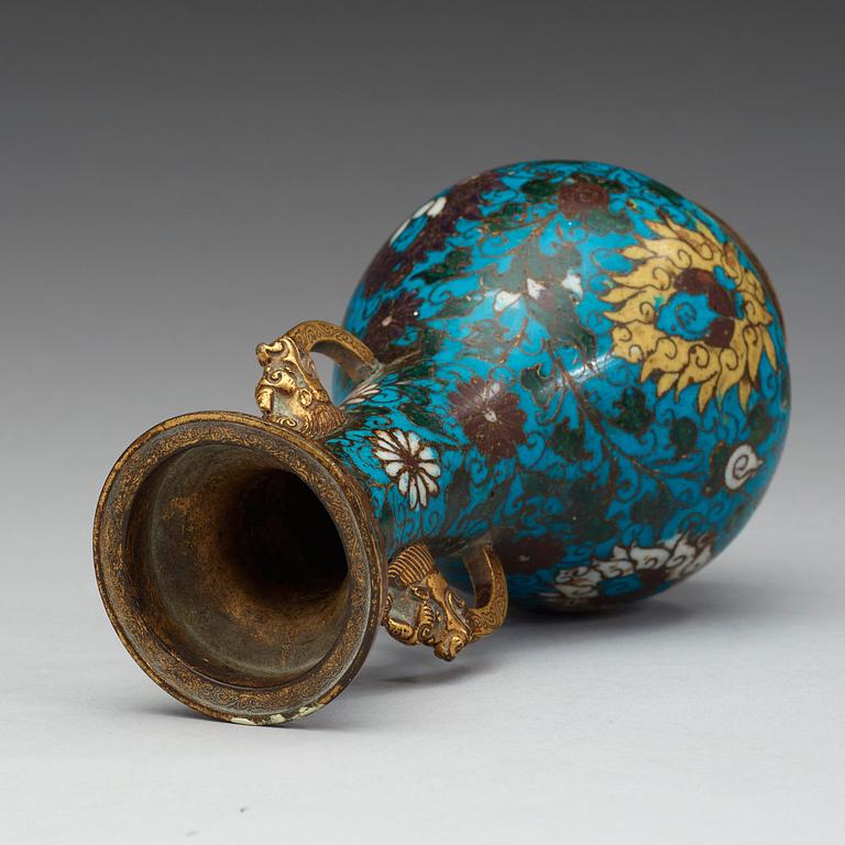 A cloisonné vase decorated with lotus-scrolls, and dragon- shaped gilded handles, Ming Dynasty (1368-1644).