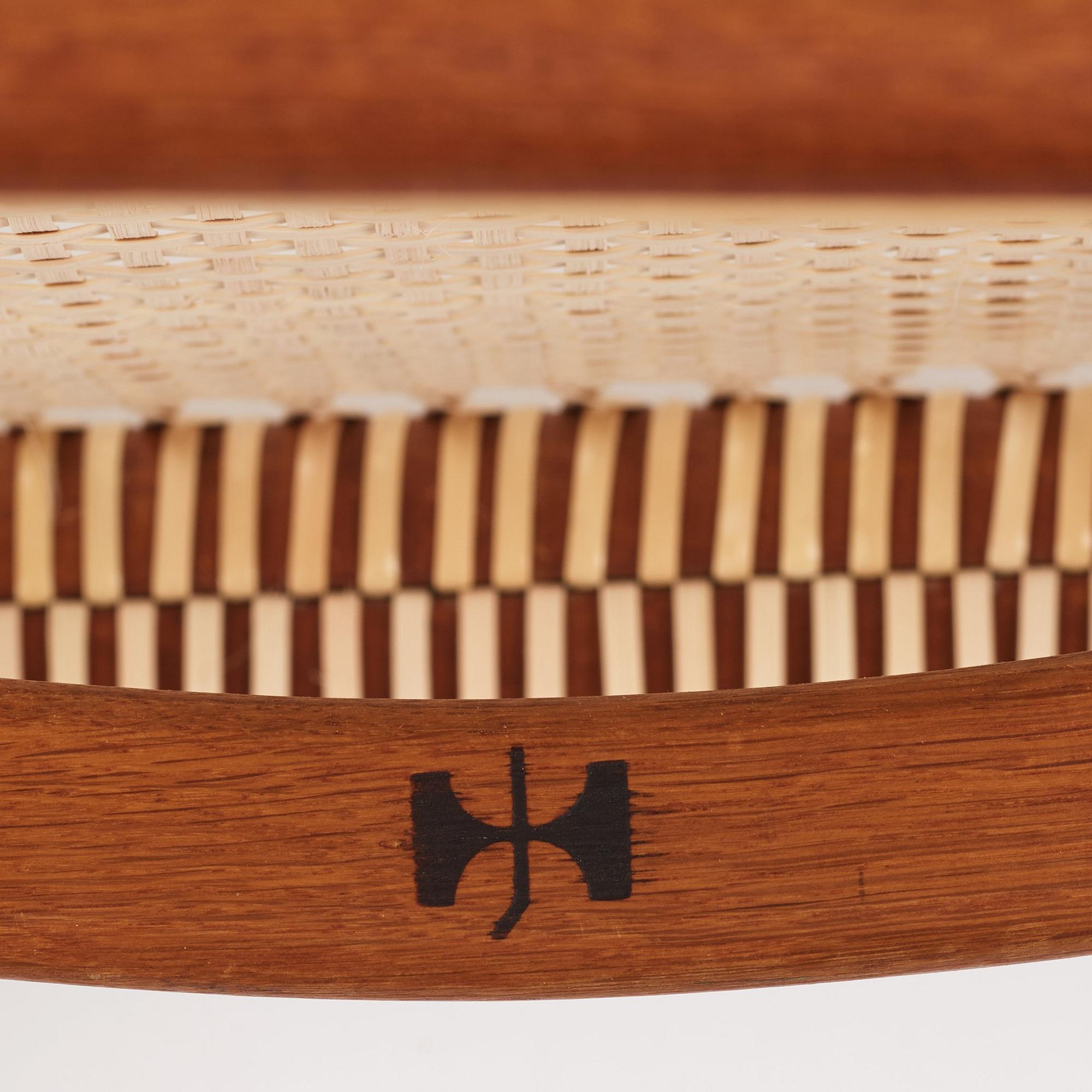 Hans J. Wegner, a pair of teak and rattan 'The Chair', JH-503, Johannes Hansen, Denmark 1950s.